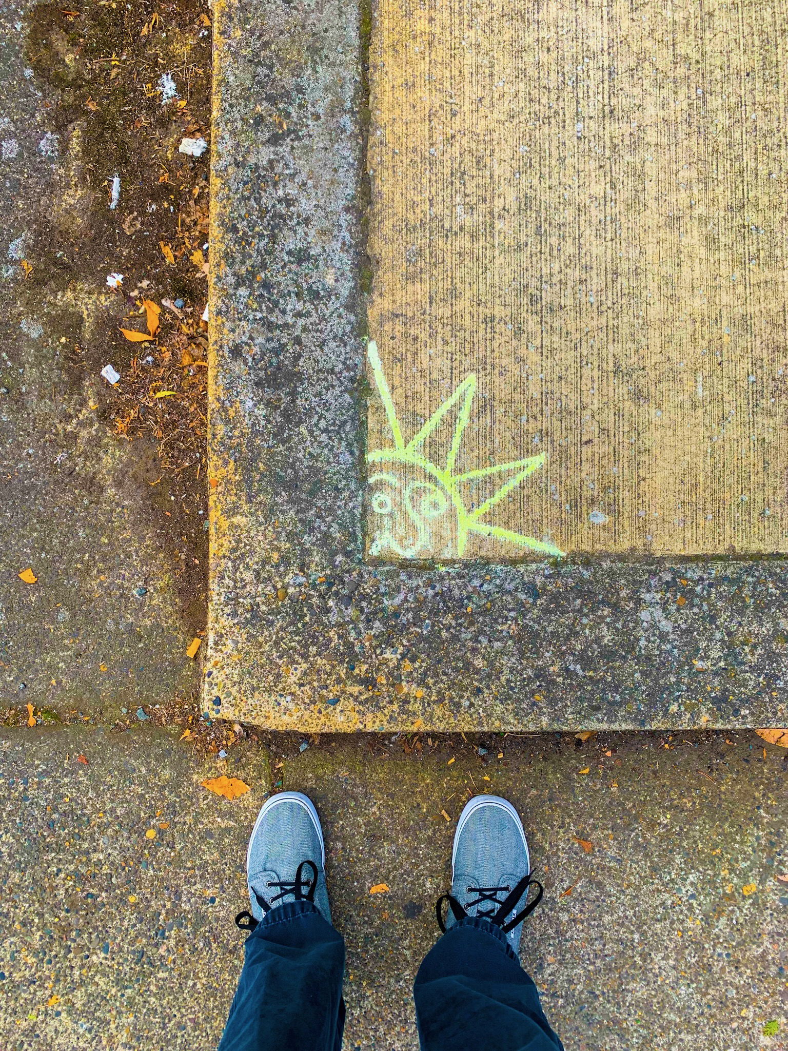 Sidewalk chalk sun and the author’s feet.