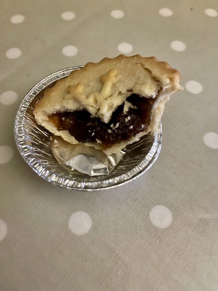 This is called a mince pie. It actually contains no mince - but rather raisins, currants, apple etc.  They’re eaten by their millions here in the UK every Christmas.