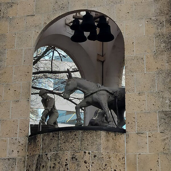 Statue framed by arc