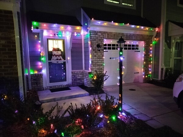 Multi color Christmas lights on front of home