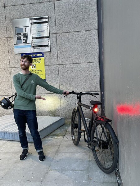 Me, presenting my bike out on the street, next to a dirty mattress