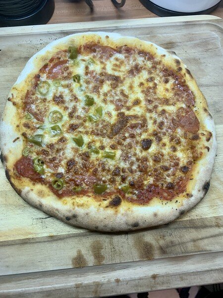 Pizza, home-made, cheese, pepperoni salami and half hot pepperoncini.

It was delicious!