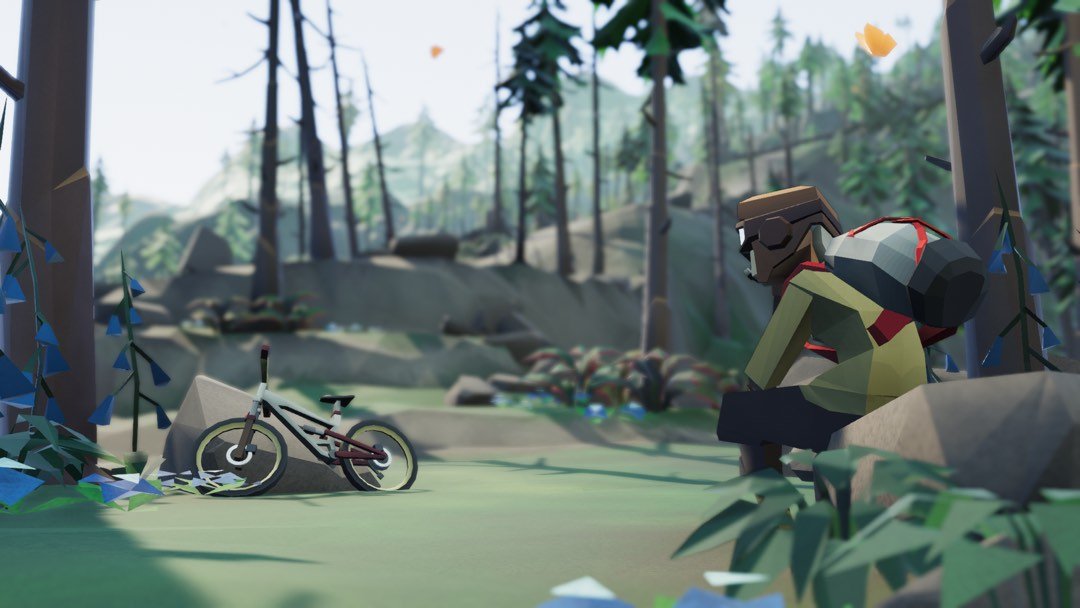Screenshot: Ein Radfahrer sitzt auf einem Stein und beobachtet sein Rad, das an einem anderen Stein lehnt.