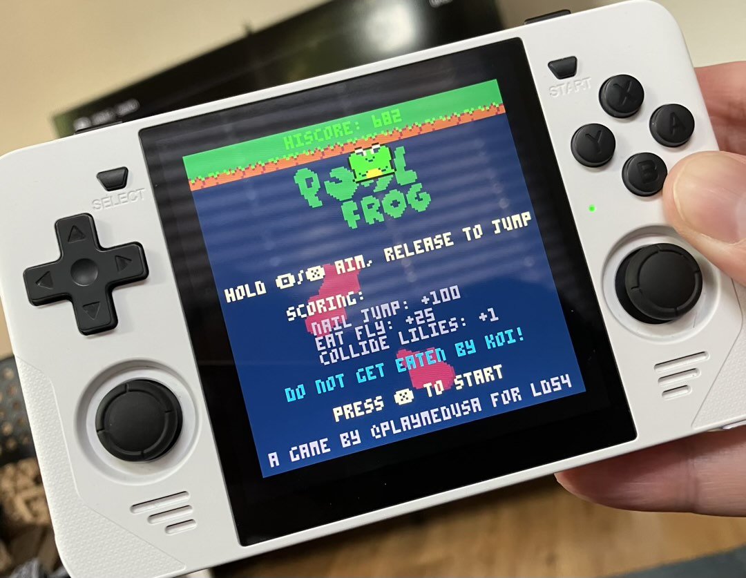 An RGB30 retro handheld running the PICO-8 game Pool Frog.