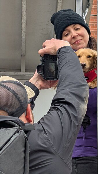 Puppies and bike races are a natural fit, even if the puppies don't know what's happening. 