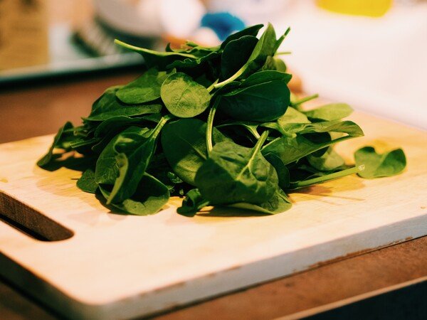 Spinach on a cutting board