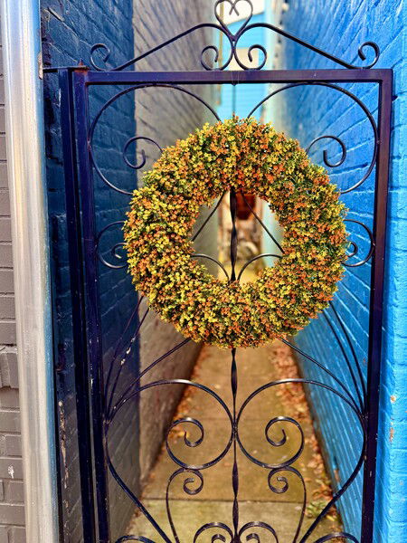 Wrought iron gate with wreath