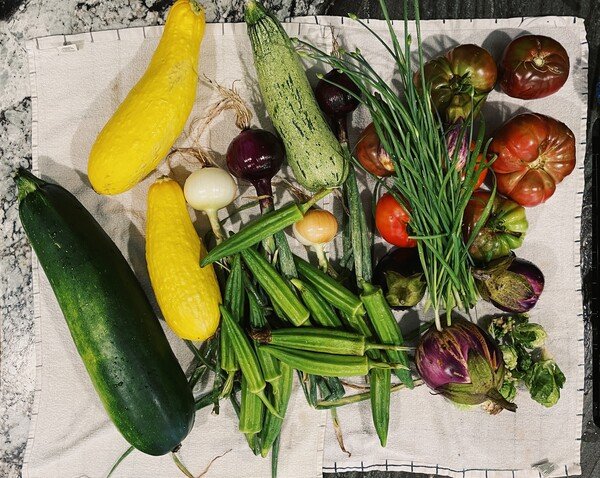 A view of a pile of garden-fresh veggies from above.