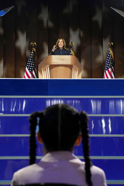 Amara Ajagu watches as Vice President Kamala Harris, the Democratic presidential nominee, speaks on the fourth day of the Democratic National Convention at the United Center in Chicago, on Thursday, August 22, 2024. Todd Heisler/The New York Times 
