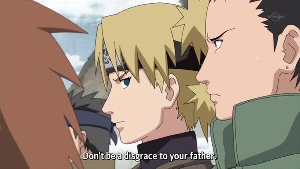 This is a still from Naruto. Temari is speaking to Shikamaru, saying 'Don't be a disgrace to your father.' Temari looks stern. Shikamaru looks a bit shaken.
