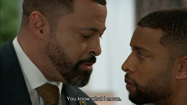Bill Hamilton (Timon Kyle Durrett) and Martin Richardson (Brandon Claybon) amidst a heated exchange. Bill says 'You know what I mean' to Martin in a menacing tone.