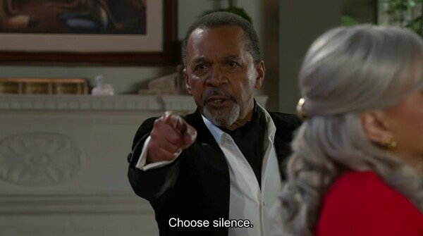 A scene from Beyond the Gates. Vernon Dupree points towards someone and says 'Choose silence.'