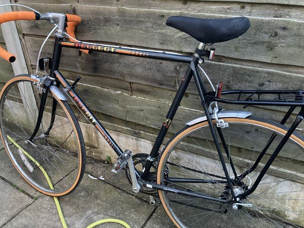 My vintage Peugeot bike, looking much fresher with a repainted saddle, polished pedals and mudguards, and a resprayed rear pannier rack