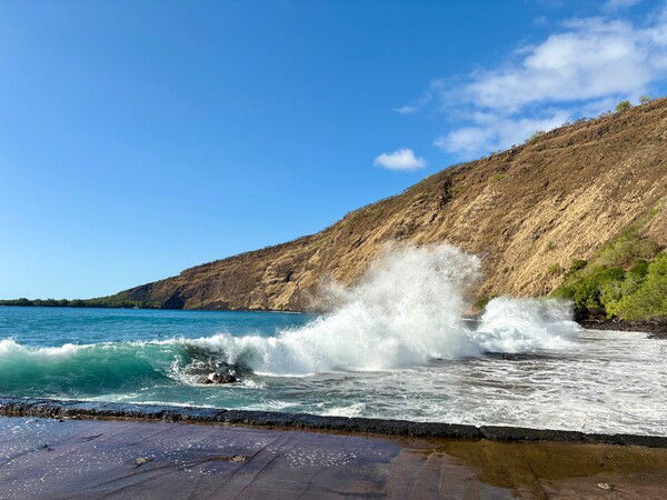 blue waves crashing in a bay