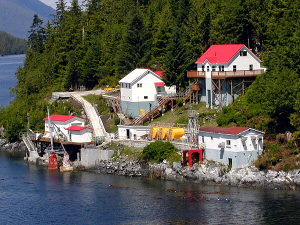The oldest digital photo I still have, a house and maybe processing plants with some wicked red roofs on the inside passage, 2002.