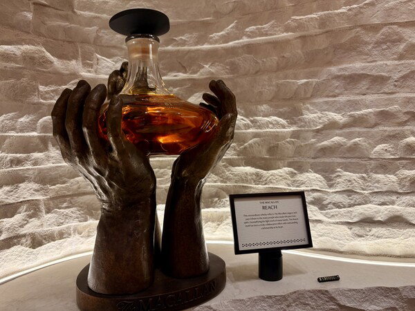 Yes, the $130,000 scotch comes with the sculpture. No, I did not buy it.