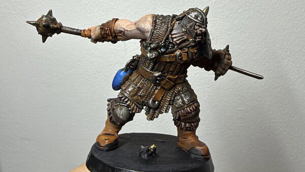 An ogre miniature, freshly painted.