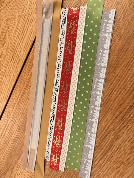 Assembling ribbons to make Christmas cards
