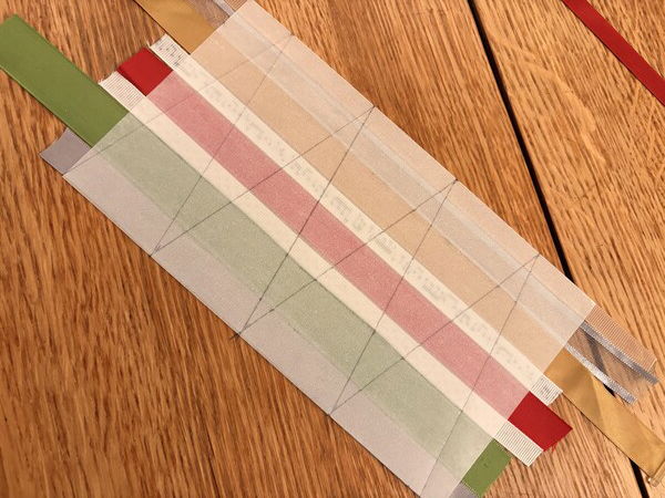 Creating triangle tree shapes on the back of the ribbon collage.