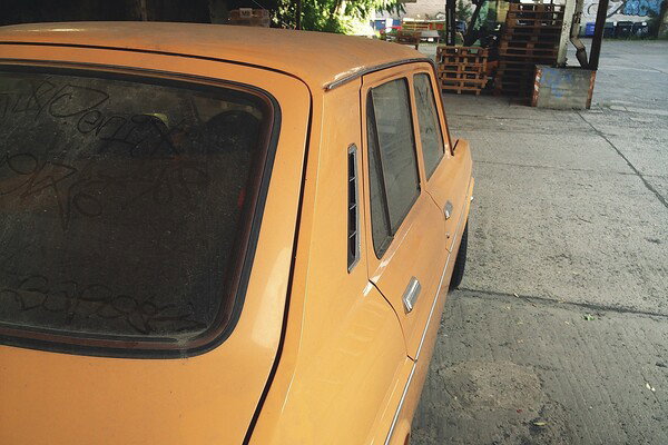 Dusty vintage yellow car