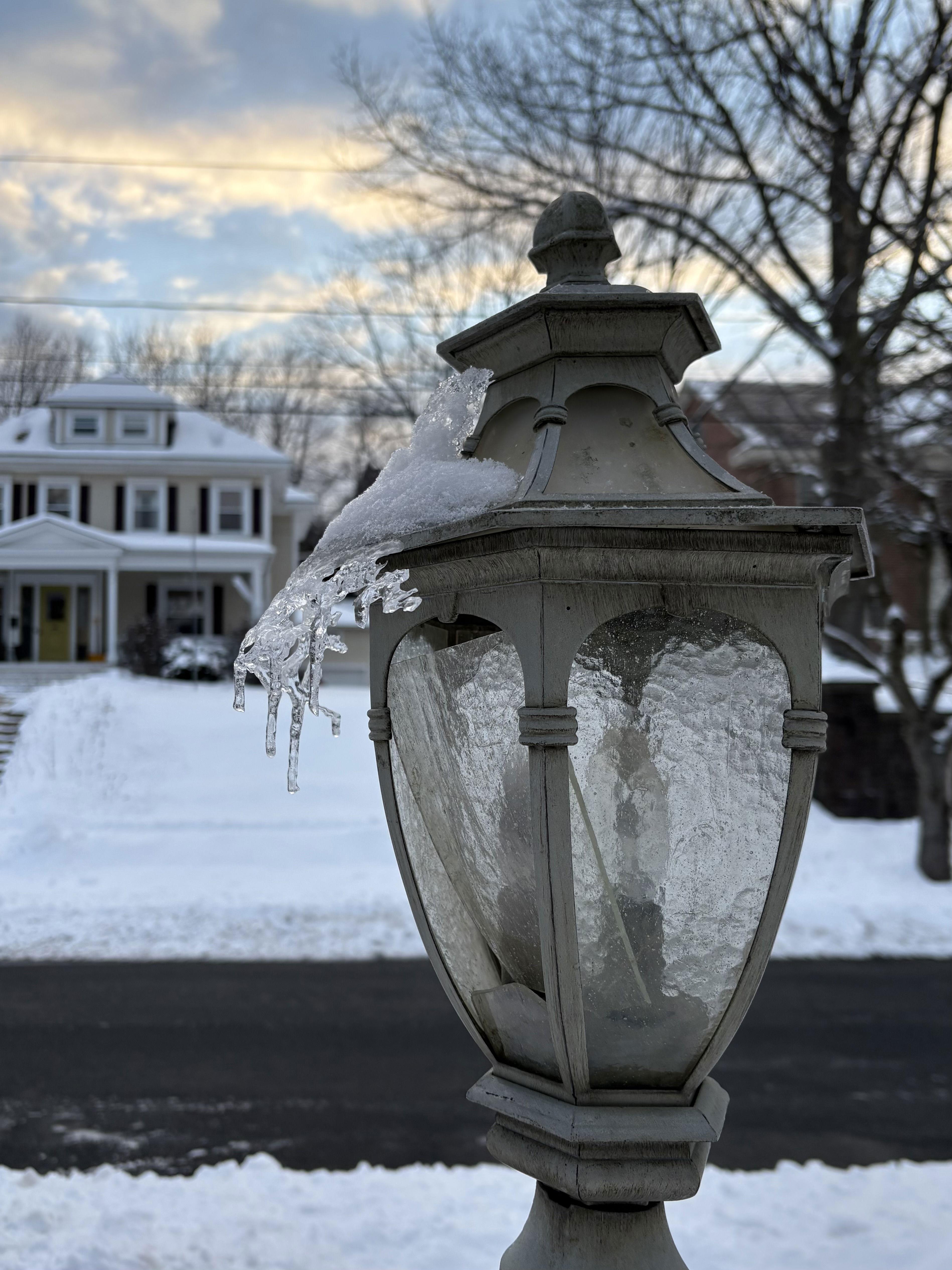 Lamppost with ice and snow