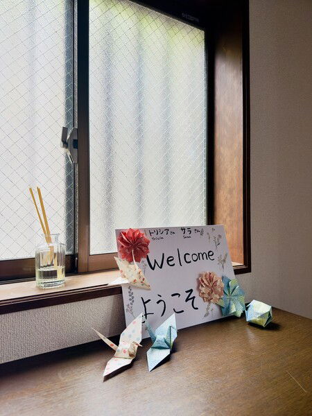 A sign and origami to welcome friends to our home. 