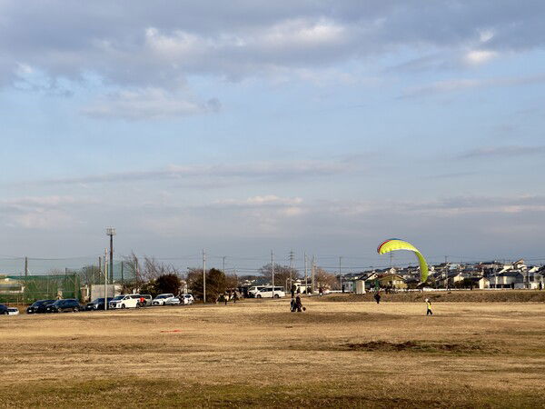 Colorful paraglider trier at the local park