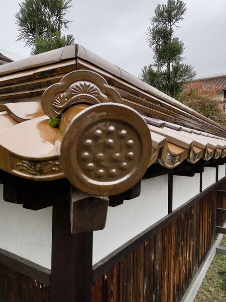 Roofing tiles on an old building in Kurayoshi, in Tottori prefecture. A friend showed me a funny ad of a roofing tile maker, and I was reminded of these.