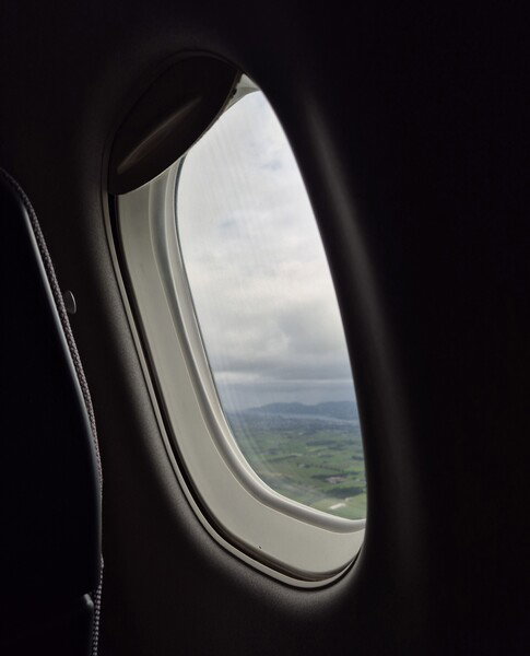 A window with a blurry view onto the fjord where I grew up 