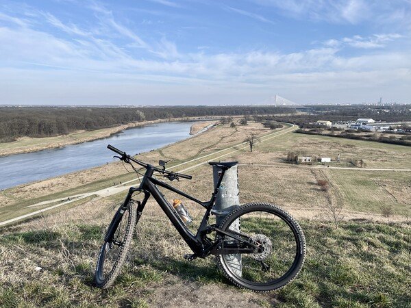 My eMTB at the top of a hill (old landfill). In the background you can see Wrocław city.