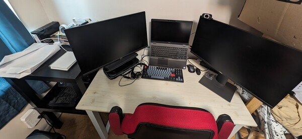 Cropped photo of my new work area. Two large monitors, dell laptop, Keychron keyboard, printer and Steamdeck.