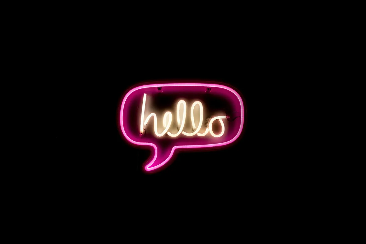 hello in neon. Image courtesy of drew beamer on unsplash