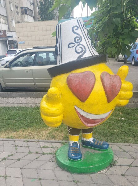 emoji sculpture with a Kyrgyz twist on the street in Bishkek