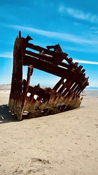 The Wreck of the Peter Iredale at Ft. Stevens State Park in Oregon. Not much remains of this four-masted steel bark built in Maryport, England, in 1890. It ran aground in 1906. 