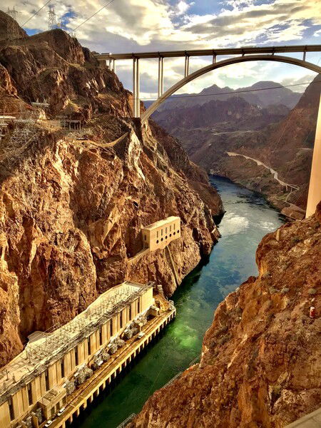 View from atop the Hoover Dam looking out at the Colorado River winding through Black Canyon and the Mike O’Callaghan - Pat Tillman Bridge.

#throwbackthursday #river #canyon #bridge #nature #desert #naturephotography

Black Canyon View © 2025 by Eric von Foerster is licensed under CC BY-SA 4.0

